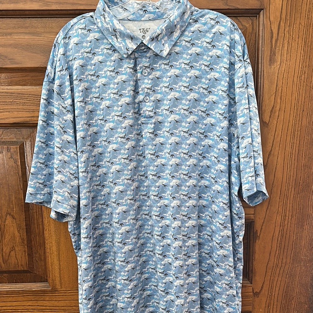Blue Polo Shirt with Fish Pattern and Moisture-Wicking Fabric